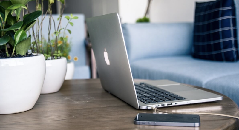 Using a laptop to compare broadband plans for flat life