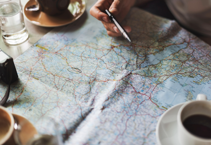 Planning a trip with map and coffee